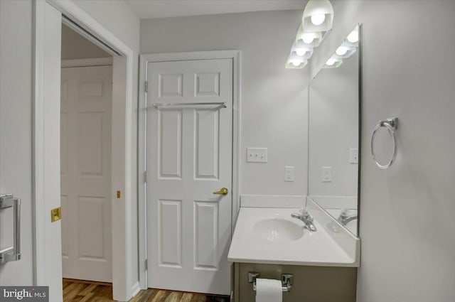 bathroom featuring vanity and hardwood / wood-style floors