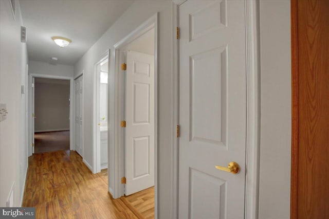 corridor featuring light wood-type flooring