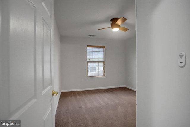 carpeted empty room with ceiling fan