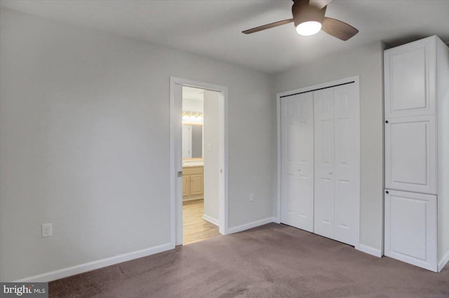 unfurnished bedroom featuring a closet, ceiling fan, and carpet flooring