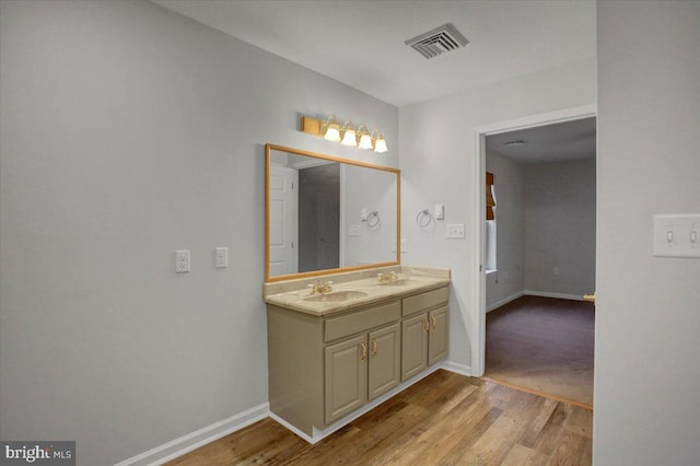 bathroom featuring vanity and hardwood / wood-style floors