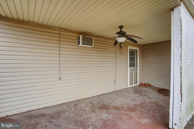 view of patio / terrace with ceiling fan and a wall mounted AC