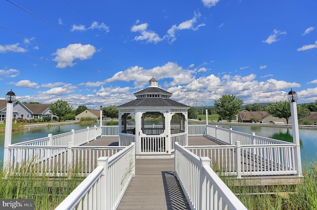 view of dock featuring a gazebo and a water view