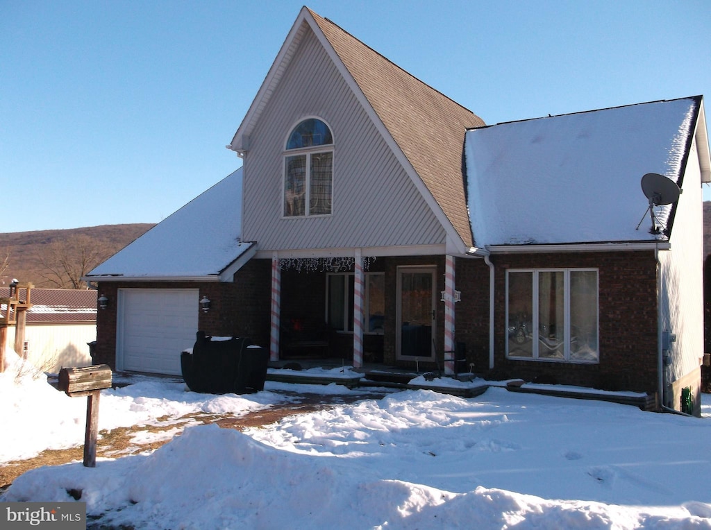 view of front facade with a porch and a garage