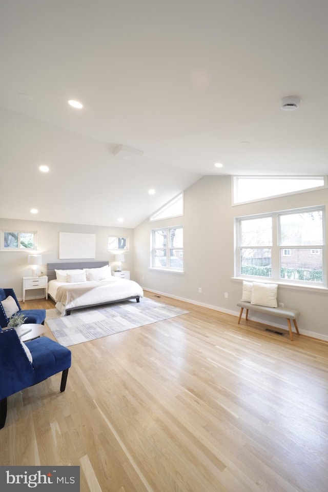 bedroom featuring vaulted ceiling and light hardwood / wood-style floors