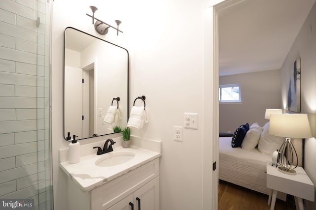 bathroom with hardwood / wood-style flooring and vanity