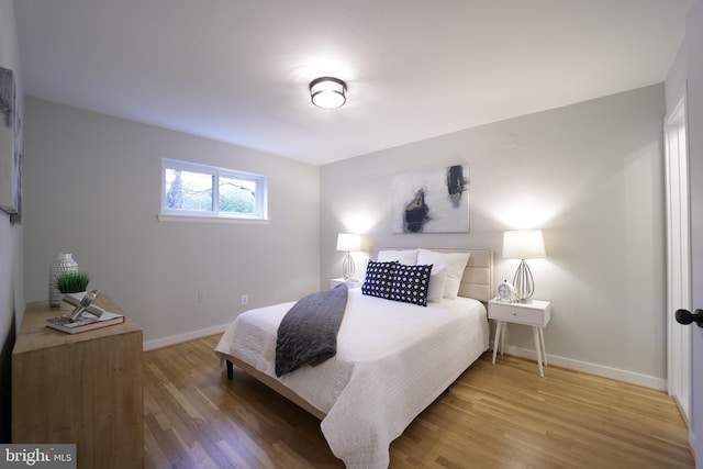 bedroom with wood-type flooring