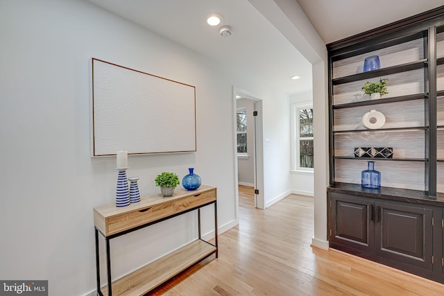 hall with light hardwood / wood-style flooring