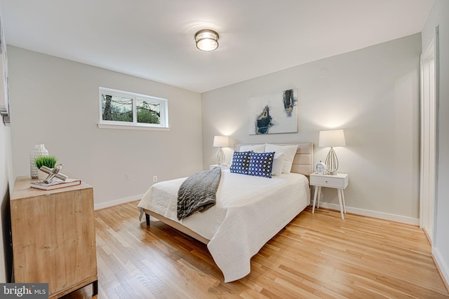 bedroom with hardwood / wood-style floors