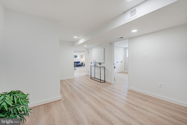 spare room featuring light wood-type flooring