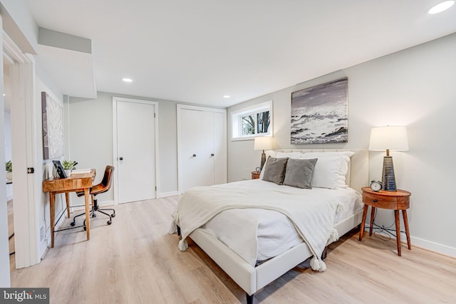 bedroom with light hardwood / wood-style flooring