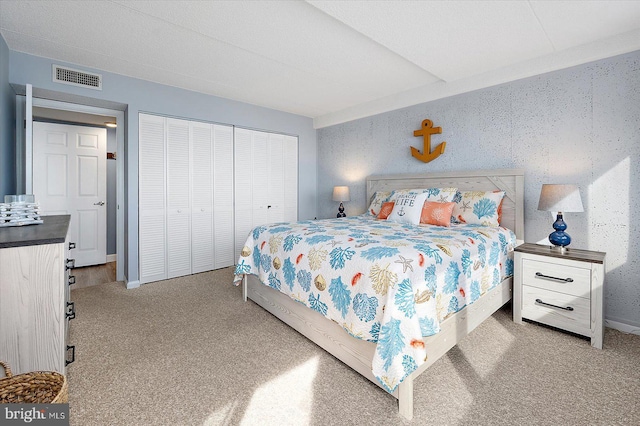 carpeted bedroom featuring a closet