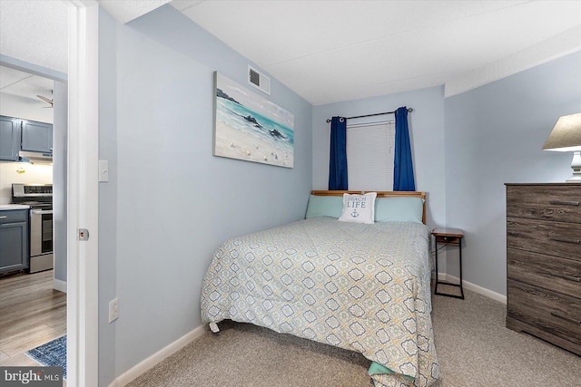 bedroom with light colored carpet