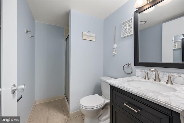 bathroom featuring vanity, an enclosed shower, tile patterned floors, and toilet