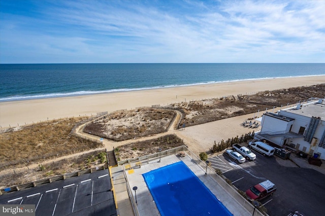 bird's eye view featuring a beach view and a water view