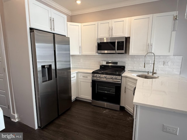 kitchen featuring white cabinetry, sink, and appliances with stainless steel finishes