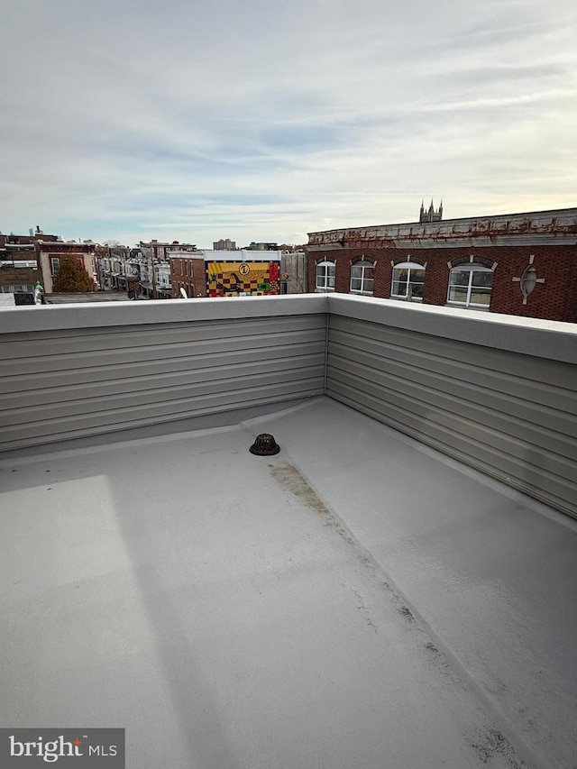 view of patio featuring a balcony