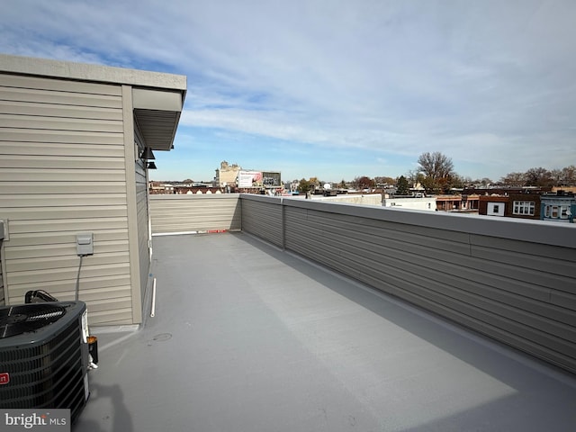 view of patio / terrace featuring cooling unit and a balcony