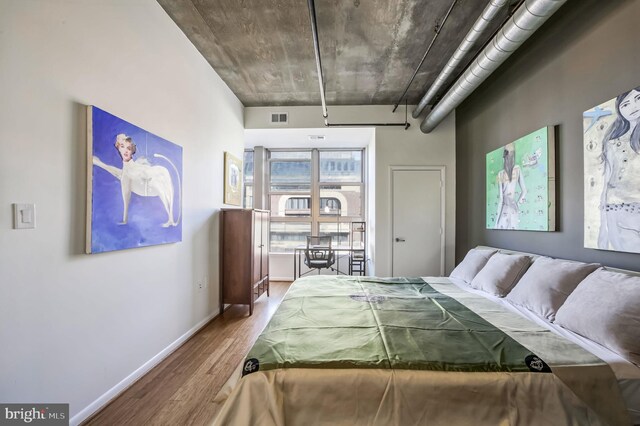 bedroom featuring hardwood / wood-style flooring