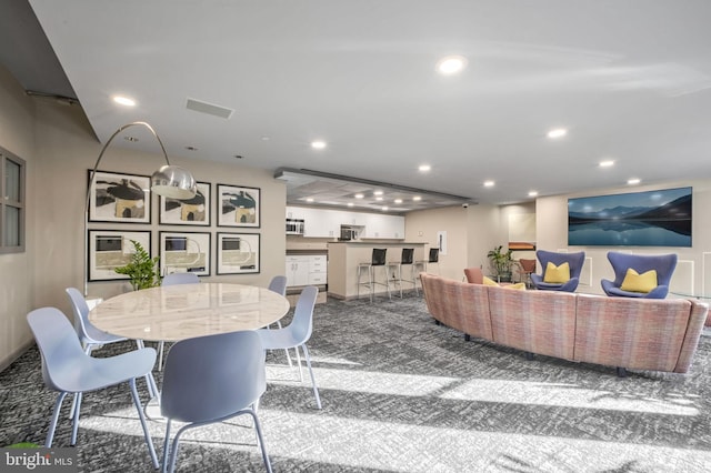 view of carpeted dining space