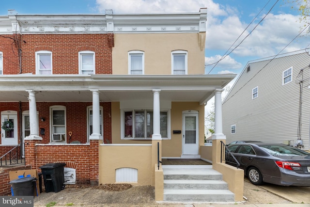 multi unit property with a porch and cooling unit