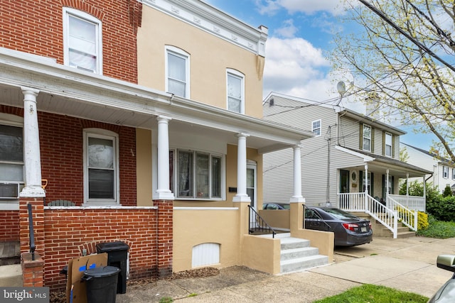 view of property featuring a porch