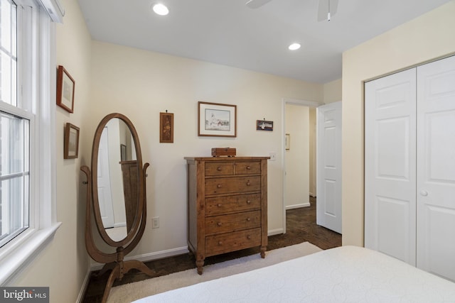 bedroom featuring ceiling fan and a closet