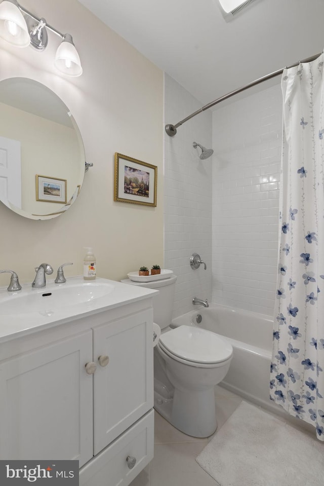 full bathroom with tile patterned flooring, vanity, shower / tub combo with curtain, and toilet