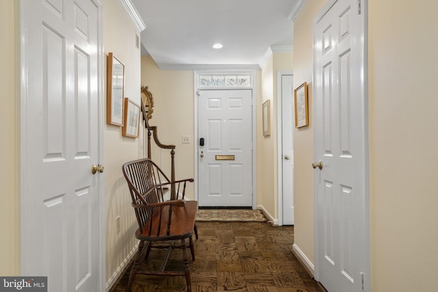 doorway to outside with ornamental molding and dark parquet floors