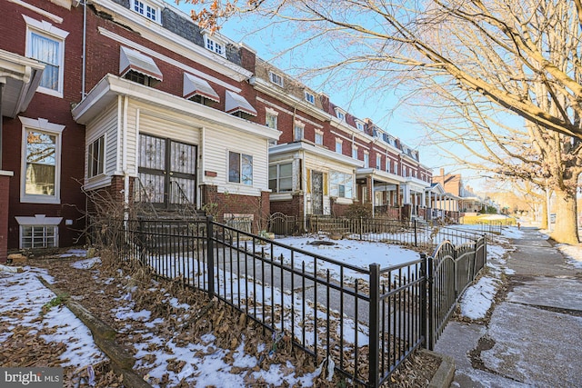 view of snow covered property