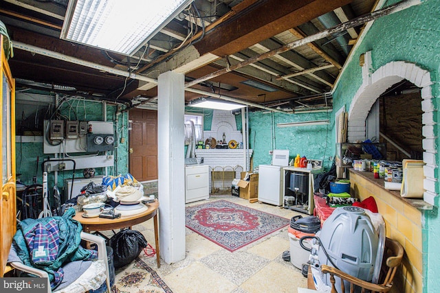 basement with refrigerator and separate washer and dryer