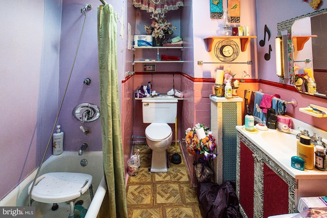 full bathroom featuring vanity, tile walls, shower / bath combination with curtain, and toilet