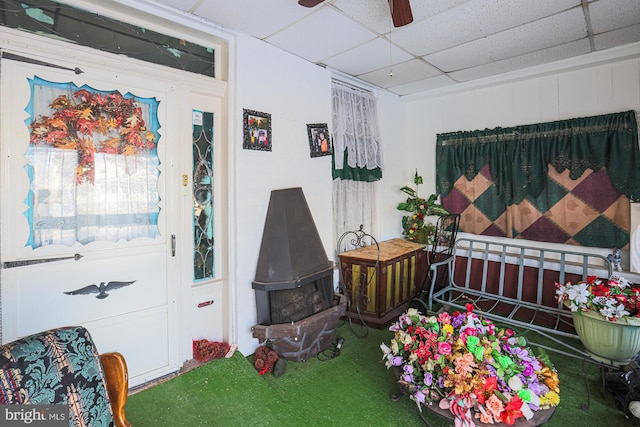 bedroom featuring carpet flooring, a paneled ceiling, and ceiling fan