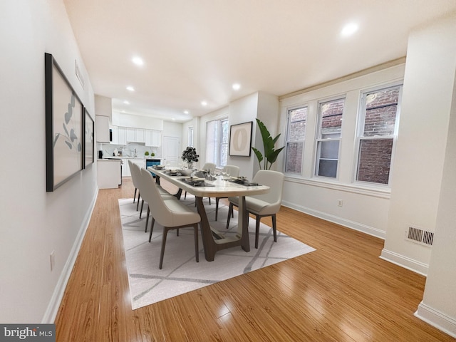 dining space featuring light hardwood / wood-style floors