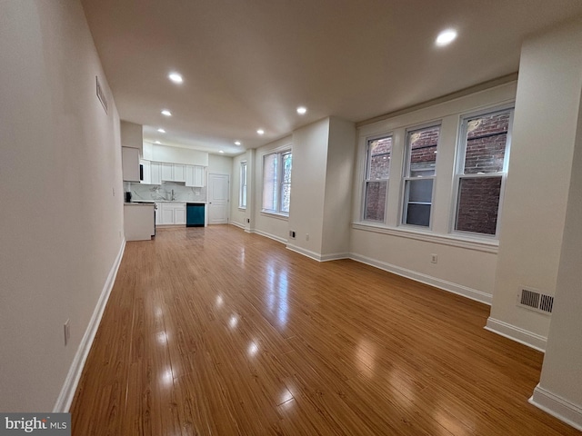 unfurnished living room featuring light hardwood / wood-style flooring