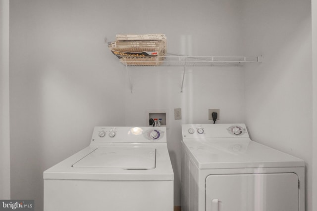 laundry room with washing machine and dryer and laundry area