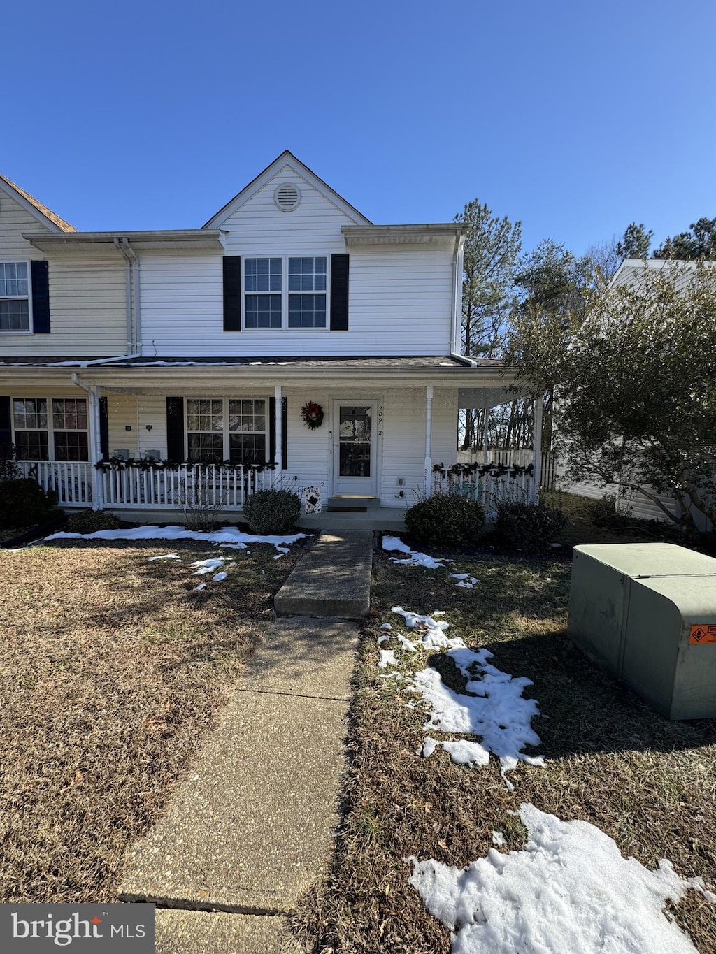 farmhouse-style home featuring a porch