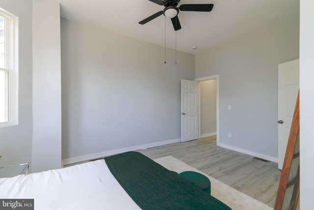 3603 Oakmont Ave, Baltimore, MD 21215 - unfurnished bedroom with wood finished floors, baseboards, and ceiling fan