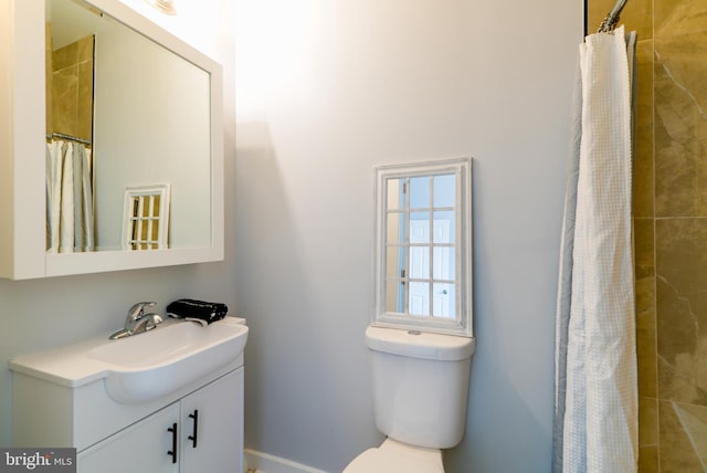 3603 Oakmont Ave, Baltimore, MD 21215 - bathroom featuring vanity, toilet, and a tile shower