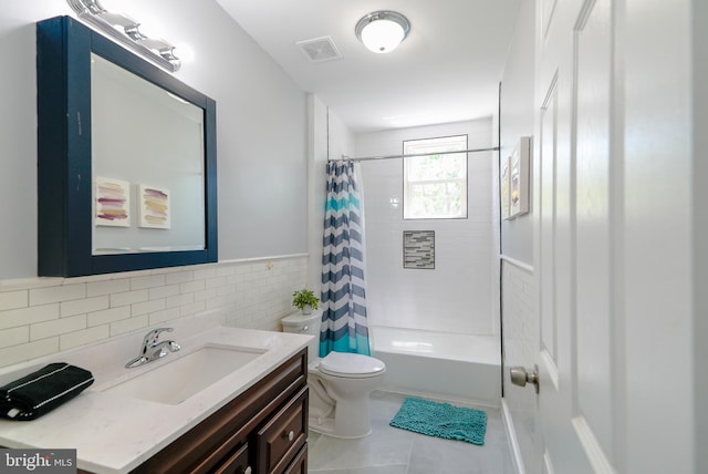 3603 Oakmont Ave, Baltimore, MD 21215 - bathroom featuring vanity, toilet, tile walls, shower / bath combo, and tile patterned flooring