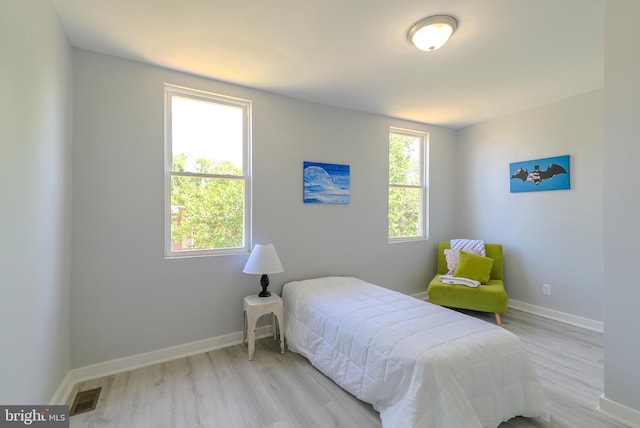 3603 Oakmont Ave, Baltimore, MD 21215 - bedroom featuring light wood-style flooring and baseboards