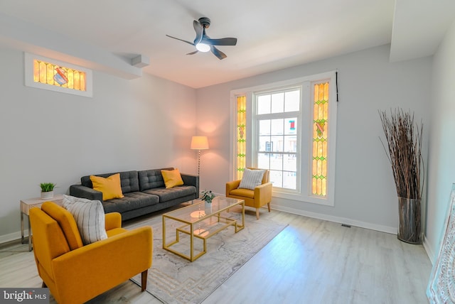 3603 Oakmont Ave, Baltimore, MD 21215 - living room featuring light wood-style flooring, ceiling fan, and baseboards