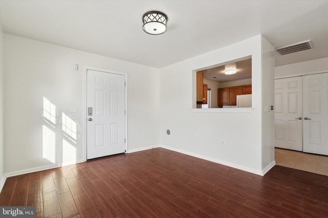 entrance foyer featuring dark hardwood / wood-style floors