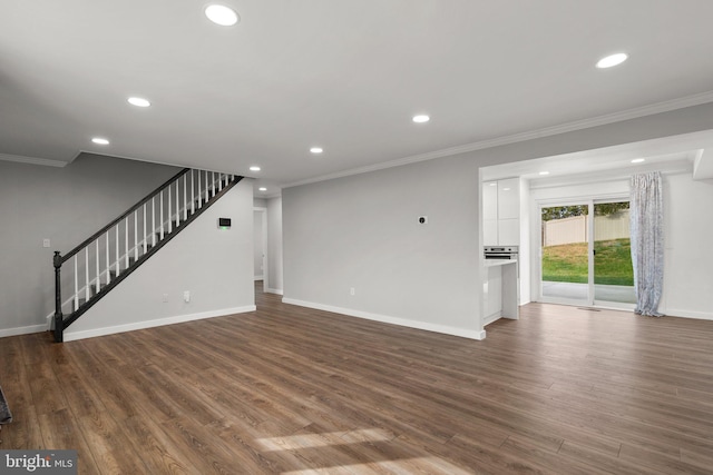 unfurnished living room featuring ornamental molding and dark wood-type flooring