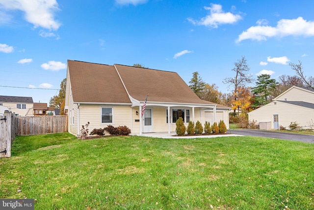 rear view of house with a yard