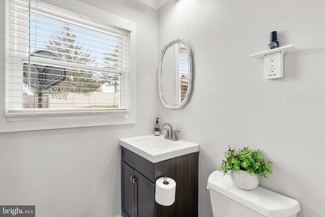 bathroom featuring vanity and toilet