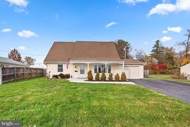 view of front of house featuring a porch, a garage, and a front yard