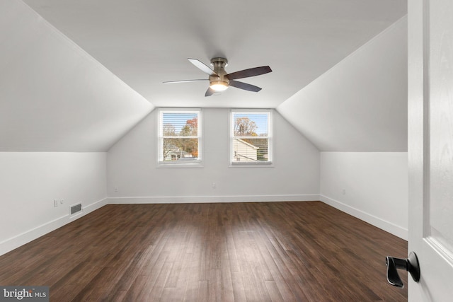 bonus room featuring ceiling fan, lofted ceiling, and dark hardwood / wood-style flooring