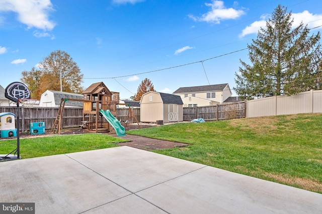 view of patio with a playground and a storage shed