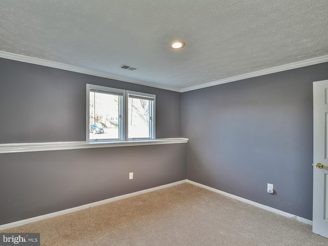 unfurnished room with crown molding, carpet flooring, and a textured ceiling